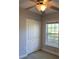 Neutral bedroom with window, ceiling fan and closet at 2025 Dixie Belle Dr # 2025, Orlando, FL 32812