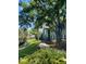 Community sidewalk with lush landscaping at 2025 Dixie Belle Dr # 2025, Orlando, FL 32812