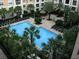 Aerial view of the pool and tropical landscaping at 204 E South St # 5058, Orlando, FL 32801