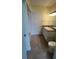 Bright bathroom with tile flooring, a single sink vanity, and shower-tub combo at 204 E South St # 5058, Orlando, FL 32801