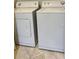 White washer and dryer set in laundry area at 204 E South St # 5058, Orlando, FL 32801