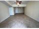 Spacious living room featuring tile flooring, baseboard trim, and neutral paint at 204 E South St # 5058, Orlando, FL 32801