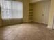 Bright living room featuring a large window for natural light and tiled floors at 204 E South St # 5058, Orlando, FL 32801