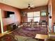 Dining room featuring wood floors, a large wooden table and chairs, and a large window at 214 Great Yarmouth Ct, Kissimmee, FL 34758