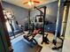 Dedicated exercise room fully equipped with weightlifting and exercise machines at 214 Great Yarmouth Ct, Kissimmee, FL 34758