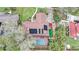 Aerial view of home with an enclosed pool area, solar panels, and green backyard at 2227 Palm Vista Dr, Apopka, FL 32712