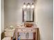 Bathroom vanity with an elevated bowl sink, a framed mirror, and a three-bulb light fixture at 2227 Palm Vista Dr, Apopka, FL 32712