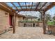 Beautifully brick paved front patio adorned with an overhead pergola and space for outdoor seating and relaxation at 2227 Palm Vista Dr, Apopka, FL 32712