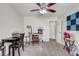 Bright home office with ceiling fan, desk, and ample workspace, perfect for remote work or creative pursuits at 2227 Palm Vista Dr, Apopka, FL 32712