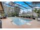 Enjoy this screened-in pool with a patio, landscaping, and great natural light at 2227 Palm Vista Dr, Apopka, FL 32712