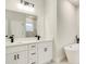 Luxurious bathroom featuring double sinks, quartz countertops, and a standalone soaking tub at 2246 Sw 167Th Pl, Ocala, FL 34475