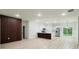 Bright open-concept living area with sliding glass doors and modern kitchen with island at 2246 Sw 167Th Pl, Ocala, FL 34475