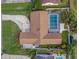 Birds-eye view of a well-maintained home with a screened pool and meticulous landscaping at 2251 Chippewa Trl, Maitland, FL 32751