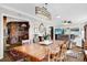 Open dining room showing a large wooden table and views into the kitchen at 2251 Chippewa Trl, Maitland, FL 32751