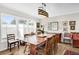 Classic dining room featuring a wooden table, chandelier, and adjacent windows at 2251 Chippewa Trl, Maitland, FL 32751