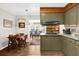 Quaint kitchen with vintage cabinets adjacent to the breakfast nook and dining area at 2251 Chippewa Trl, Maitland, FL 32751