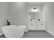 Modern bathroom features a standalone tub, dual sinks, and updated vanity at 2483 Sw 163Rd Pl, Ocala, FL 34473