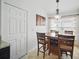 Bright dining area featuring a wooden table with seating for four and a wine rack at 2614 Brookshire Ct, Kissimmee, FL 34746