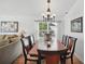 Cozy dining area featuring a large wooden table and a view of the adjacent living space at 2614 Brookshire Ct, Kissimmee, FL 34746