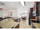 Modern kitchen featuring stainless steel appliances, granite countertops, and a view into the dining area at 2614 Brookshire Ct, Kissimmee, FL 34746