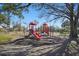 Community playground with play equipment, swings and a picnic area at 2614 Brookshire Ct, Kissimmee, FL 34746