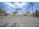 Community tennis court with a playground in the background, offering residents diverse recreational options at 2614 Brookshire Ct, Kissimmee, FL 34746