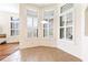 Inviting breakfast nook with an abundance of windows and natural light shining through window shutters at 27127 Stoney Brook Dr, Leesburg, FL 34748