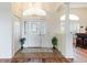 Bright foyer featuring decorative glass front door, tile floor and views to the living spaces at 27127 Stoney Brook Dr, Leesburg, FL 34748