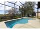 Private screened-in pool offers a refreshing outdoor oasis with a view at 27127 Stoney Brook Dr, Leesburg, FL 34748