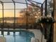 Relax in this screened-in pool and enjoy the view of the sunset over the lake at 27127 Stoney Brook Dr, Leesburg, FL 34748