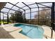 Relax in this screened-in pool with a spacious deck and room for outdoor seating at 27127 Stoney Brook Dr, Leesburg, FL 34748