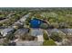 Aerial view of home, showcasing a serene neighborhood with a picturesque pond at 2732 Aloma Oaks Dr, Oviedo, FL 32765