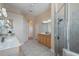 Bright bathroom featuring double sinks, a glass shower, and tile flooring at 2732 Aloma Oaks Dr, Oviedo, FL 32765