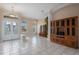 The expansive open floor plan shows the foyer with glass front doors, chandelier and front windows at 2732 Aloma Oaks Dr, Oviedo, FL 32765