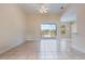 Living room with tile flooring and views of the lake at 2732 Aloma Oaks Dr, Oviedo, FL 32765