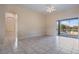 Bright living room with tile flooring and sliding glass doors to the pool and patio at 2732 Aloma Oaks Dr, Oviedo, FL 32765