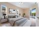 Bright main bedroom featuring hardwood floors, serene decor, and a sliding glass door to the outdoor patio at 2732 Aloma Oaks Dr, Oviedo, FL 32765