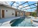 Screened-in pool area with a beautiful view and a water feature at 2732 Aloma Oaks Dr, Oviedo, FL 32765