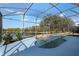 Screened-in pool with views of the pond at 2732 Aloma Oaks Dr, Oviedo, FL 32765