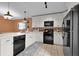 Bright kitchen featuring white cabinetry, modern appliances, tile backsplash and floors at 3038 Woolridge Dr, Orlando, FL 32837