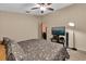 Comfortable main bedroom with ceiling fan, natural lighting, and neutral decor at 3038 Woolridge Dr, Orlando, FL 32837