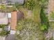 Aerial view of the property and backyard with large trees at 310 Sunvista Ct, Sanford, FL 32773