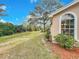 Spacious backyard featuring well-maintained grass and lush greenery with a view of mature trees at 310 Sunvista Ct, Sanford, FL 32773