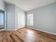 Cozy bedroom featuring wood flooring, a window and neutral colors at 310 Sunvista Ct, Sanford, FL 32773