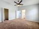 Spacious bedroom featuring an ensuite bath, closet, and neutral walls at 310 Sunvista Ct, Sanford, FL 32773