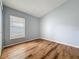 Bedroom featuring a window, wood flooring and neutral colors at 310 Sunvista Ct, Sanford, FL 32773