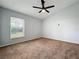 Comfortable bedroom featuring a ceiling fan and natural light from a window at 310 Sunvista Ct, Sanford, FL 32773