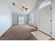 Bright living room with ceiling fan, carpeted floors and sliding glass doors, creating a comfortable and airy atmosphere at 310 Sunvista Ct, Sanford, FL 32773