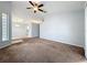 Spacious living room featuring carpeted floors, neutral paint, and an open layout for versatile living at 310 Sunvista Ct, Sanford, FL 32773