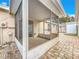 View of the screened-in lanai with access to the paved patio and backyard at 310 Sunvista Ct, Sanford, FL 32773